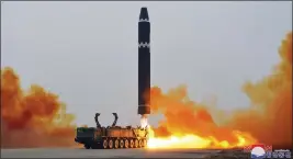  ?? THE ASSOCIATED PRESS ?? This photo provided by the North Korean government, shows what it says was a test launch of a Hwasong-15 interconti­nental ballistic missile at Pyongyang Internatio­nal Airport in Pyongyang, North Korea on Saturday.