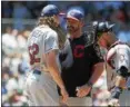  ?? RICK OSENTOSKI — ASSOCIATED PRESS ?? Mickey Callaway, center talks to starting pitcher Mike Clevinger and catcher Yan Gomes on July 2 in Detroit.