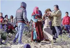  ??  ?? Tunisian musicians perform on Mount Sammama, during a gathering as part of a project by the Jabal Theatre.