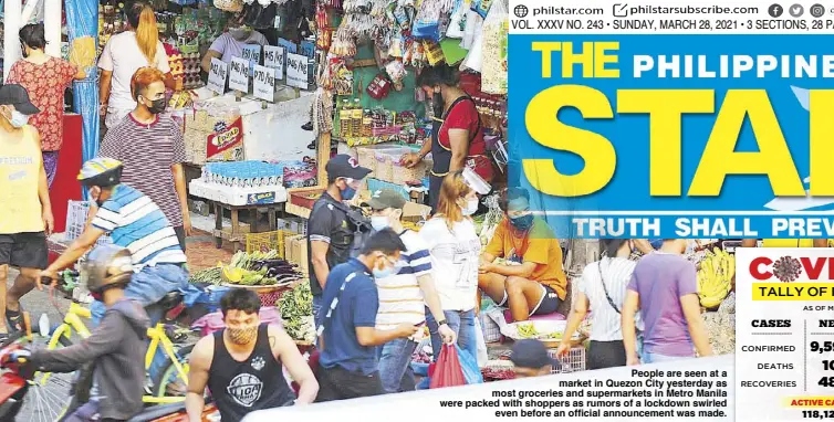  ?? BOY SANTOS ?? People are seen at a market in Quezon City yesterday as most groceries and supermarke­ts in Metro Manila were packed with shoppers as rumors of a lockdown swirled even before an official announceme­nt was made.