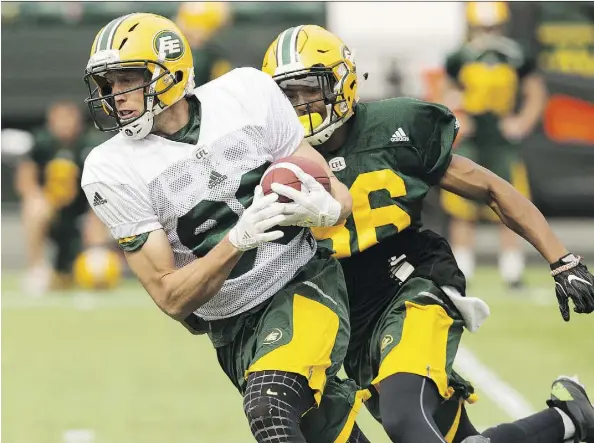  ?? IAN KUCERAK ?? Eskimos’ Chris Getzlaf, left, knows the thrill of winning a Grey Cup at home. He was with Saskatchew­an when they won in 2013.