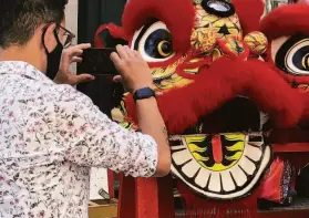  ?? ?? A troupe called Lion Dance Me practices on Grant Avenue in Chinatown.