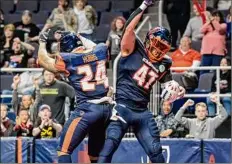  ?? James Franco / Special to the Times Union ?? Receiver/defensive back Arthur Hobbs and lineman Nick Haag celebrate a touchdown vs. Carolina in their home opener on April 23, the last time the Empire played in Albany.