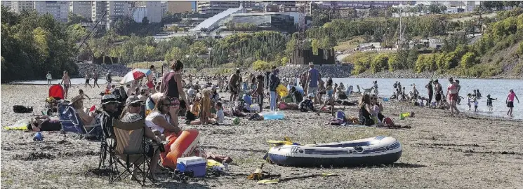  ?? CODIE MCLACHLAN ?? People enjoy an August summer day on Accidental Beach. It may be gone when the snow melts, but it got us to view the river in a new way, Paula Simons writes.