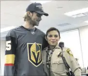  ??  ?? Heidi Fang Las Vegas Review-Journal @HeidiFang
Golden Knights defenseman Jon Merrill and Metro detective Maria Fulwiler.