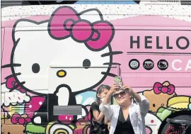  ?? STAFF FILE PHOTO ?? Sara Platero of Scotts Valley takes a selfie with her daughter Mia, 7, at the Hello Kitty Cafe Truck appearance in Santana Row in San Jose in 2015.