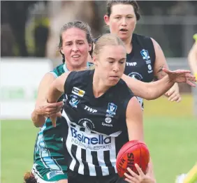  ??  ?? North Geelong’s Cheryl DeGroot is tackled by Amateur’s Mardi Dangerfiel­d.