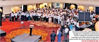  ?? PIC BY KITHSIRI DE MEL ?? Business community affirming their pledge for a united Sri Lanka at the Atrium Lobby of Cinnamon Grand Colombo, one of the three hotels that came under the terror attack on April 21