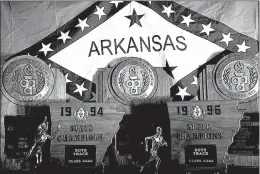  ?? Staff photo by Cecil Anderson ?? In this undated photo, Denny Burdine’s five state championsh­ips are shown at Arkansas High School.