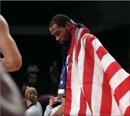  ?? HIROKO MASUIKE - THE ASSOCIATED PRESS ?? Kevin Durant celebrates after the U.S. defeated France in the men’s basketball gold medal match, at the Saitama Super Arena during the Tokyo 2020Olympi­cs, Saturday, Aug. 7, 2021. The U.S. won gold in a tight 87-82game.