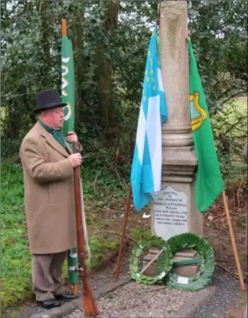  ??  ?? Ray Murphy, chairman of Enniscorth­y Historical Re-enactment Society, at the grave of Charlie Farrell at Corrig Graveyard at St John’s Enniscorth­y.