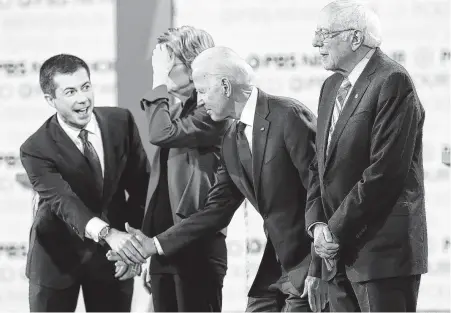  ?? Tribune News Service file photo ?? Several Democratic candidates, including South Bend, Ind., Mayor Pete Buttigieg, left, and Joe Biden, have been criticized for not making more of an outreach effort with Latino voters. Sen. Bernie Sanders has quietly been building a base of support.