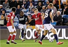  ?? ?? Bristol City’s Cam Pring tries to get past Millwall striker Benik Afobe