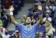  ?? THE ASSOCIATED PRESS ?? Novak Djokovic waves after defeating Jerzy Janowicz during the first round of the U.S. Open tennis tournament Monday in New York.