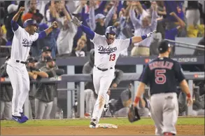  ?? Mark J. Terrill / Associated Press ?? Dodgers first baseman Max Muncy celebrates after his walk-off home run against the Red Sox in the 18th inning in Game 3 of the World Series early Saturday morning.