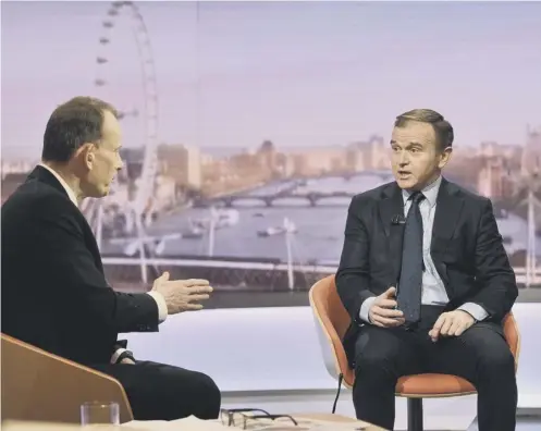  ??  ?? 0 The UK Environmen­t Secretary George Eustice, right, talks to host Andrew Marr on the BBC’S Andrew Marr Show yesterday