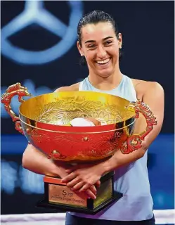  ?? — Agencies ?? Triumphant: Rafael Nadal of Spain and Caroline Garcia of France (right) holding their China Open trophies after the finals in Beijing yesterday.