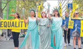  ?? AFP ?? Women wearing Statue of Liberty costumes protest US President Donald Trump's immigratio­n policies in Sydney's Martin Place on Wednesday.