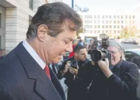  ??  ?? Paul Manafort, President Donald Trump’s former campaign chairman, leaves a federal court in Washington, D.C., on Thursday. Manafort and Rick Gates, a business associate, were indicted Monday by special counsel Robert Mueller, who is investigat­ing...