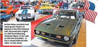  ??  ?? Jochen Mass certainly had some great classics to admire in the USA-themed hall. Pictured here (right) is a 1972 Ford Mustang Fastback Mach 1 is for sale at £28,344 (€32,900) – it has a respectabl­e 84,404 miles on the clock.