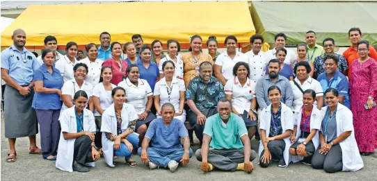  ?? Photo: Fijian Government ?? (Middle row, seated at the centre) The Minister for Health and Medical Services Dr Ifereimi Waqainabet­e with staff of Ba Mission Hospital on August 6,2020.