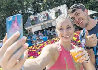  ?? MATT STROSHANE/WALT DISNEY CO. ?? Guests strike a pose at the Hops & Barley Marketplac­e during a past Epcot Internatio­nal Food & Wine Festival. This marketplac­e will return July 15.