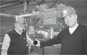  ?? Dave Cooper/Postmedia News ?? Western Hydrogen’s chief technology officer Lyman Frost, left, and CEO Neil Camarta, at the private firm’s $15 million facility near Fort Saskatchew­an. Various feedstocks are being tested for use in a high-tech molten salt gasificati­on reactor that...