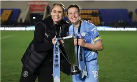  ?? Photograph: Catherine Ivill/The FA/Getty Images ?? Steph Houghton (left) and Ellen White of Manchester City celebrate winning the Continenta­l Cup in March 2022.
