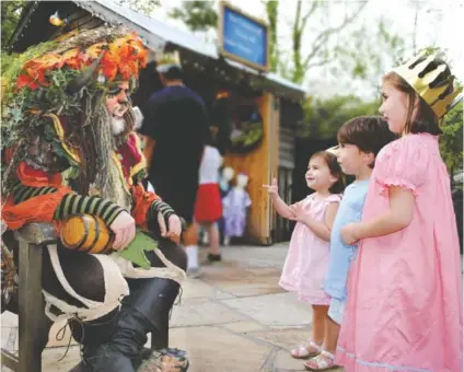  ?? PHOTO CONTRIBUTE­D BY ROCK CITY ?? Children greet the Troll King at Fairytale Nights.