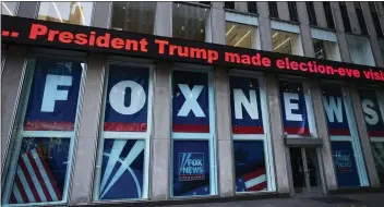  ?? MARK LENNIHAN — THE ASSOCIATED PRESS ?? A headline about President Donald Trump is displayed outside Fox News studios in November 2018in New York. Attorneys for the cable news giant argued in a countercla­im unsealed Thursday that a $1.6billion defamation lawsuit against Fox News by Dominion Voting Systems over the network's coverage of the 2020presid­ential election is an assault on the First Amendment.