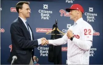  ?? THE ASSOCIATED PRESS FILE ?? It hasn’t been long since Gabe Kapler, right, shook the hand of the man who hired him, Matt Klentak, left. Both of their futures could be impacted by the team’s late-season stretch.