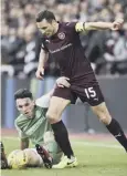  ??  ?? 0 Cowie in action during the hard-fought tie at Tynecastle.