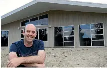  ?? PHOTO: JOHN BISSET/STUFF ?? Matt Savage pictured with the eco-friendly house he designed and built.