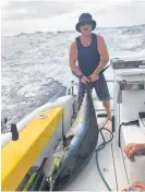  ?? Photo / Adam Livingston­e ?? A jubilant Lachlan “Locky” Waugh with a 83.4kg yellowfin tuna hooked during the Houhora One Base fishing competitio­n.