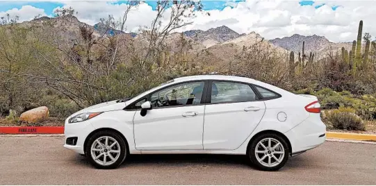  ?? HENRY PAYNE/THE DETROIT NEWS ?? The 2017-2019 Ford Fiesta SE is a great bargain for those doing online car shopping.