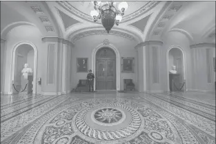  ?? J. SCOTT APPLEWHITE/AP ?? Empty corridors around the Senate are seen at the Capitol in Washington on Thursday during a partial government shutdown. Chances look slim for ending the partial government shutdown anytime soon.