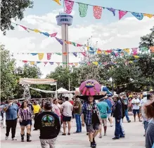  ?? Josie Norris/staff file photo ?? Attendees stroll about during the first night of A Night In Old San Antonio at La Villita last year. Nearly 10,000 volunteers make this Fiesta event possible.