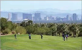  ?? DAVID BECKER / AP ?? Robert Streb, center, takes his second shot on the eighth hole during first round of the CJ Cup golf tournament Thursday in Las Vegas.