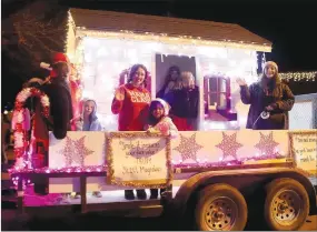  ?? LYNN KUTTER ENTERPRISE-LEADER ?? Touch of Color hair salon of Prairie Grove is one of many businesses that participat­ed in Prairie Grove’s Christmas Parade of Lights on Dec. 11.