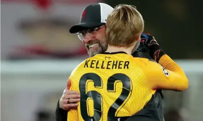  ??  ?? Jürgen Klopp embraces the 22-year-old goalkeeper Caoimhín Kelleher after Liverpool’s Champions League win over Ajax this month. Photograph: Soccrates Images/Getty Images
