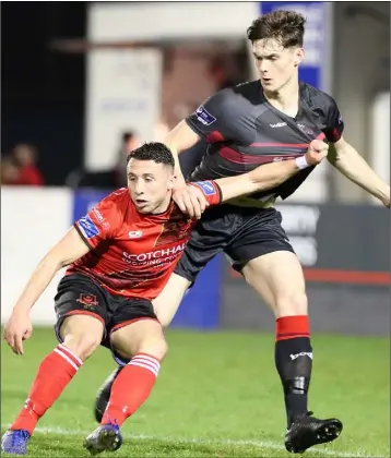  ??  ?? Drogheda United’s Chris Lyons holds off Wexford F.C. centre-half Darragh O’Connor.