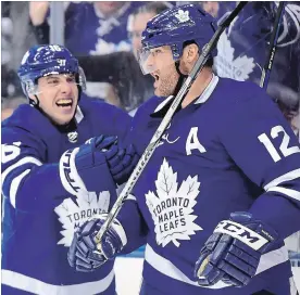 ?? CANADIAN PRESS FILE PHOTO ?? Toronto veteran forward Patrick Marleau, right, was happy to learn that, over the summer, teammate Mitch Marner has given up junk food for healthier alternativ­es.