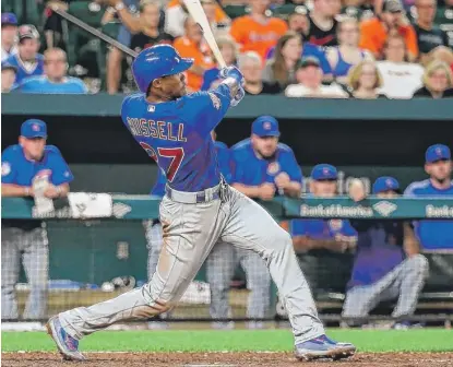  ?? | GETTY IMAGES ?? Shortstop Addison Russell hits a go- ahead solo home run in the ninth inning against the Orioles on Friday in Baltimore.