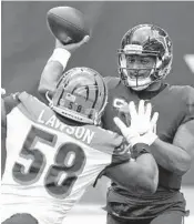  ?? ERIC CHRISTIAN SMITH/AP ?? Texans quarterbac­k Deshaun Watson (4) is pressured by Bengals defensive end Carl Lawson in a game on Dec. 27.