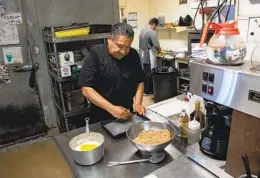  ?? ADRIANA HELDIZ U-T PHOTOS ?? Chef Jesus Yoguez Aguilar makes baklava in the kitchen at Athens Market, where he’s worked for nearly 40 years. Many on staff are longtime employees.