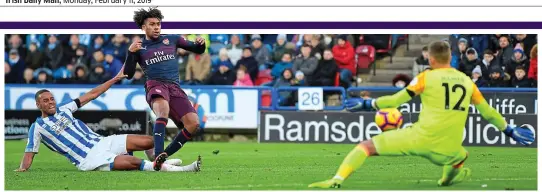  ?? GETTY IMAGES ?? Not this time: Arsenal goalscorer Alex Iwobi is denied by Huddersfie­ld goalkeeper Ben Hamer