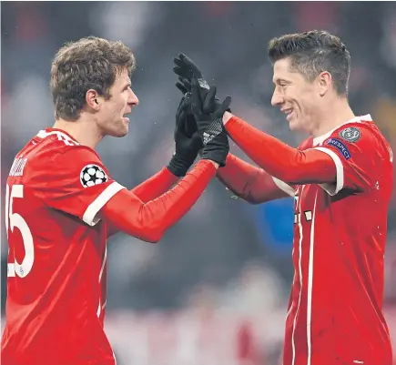  ?? ABOVE ?? Bayern Munich’s Thomas Mueller, left, and Robert Lewandowsk­i each scored two goals against Besiktas.
