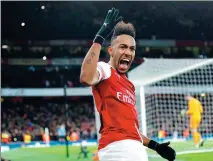  ?? EDDIE KEOGH / REUTERS ?? Pierre-Emerick Aubameyang celebrates scoring from the penalty spot to earn Arsenal a 2-0 English Premier League victory over Manchester United in London on Sunday.