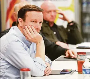  ?? Randy Hoeft / Associated Press ?? Sen Chris Murphy, D-Conn., listens to a presentati­on during a bipartisan discussion about issues at the U.S.-Mexico border in the Yuma, Arizona region Tuesday at the Regional Center for Border Health in Somerton, Ariz.