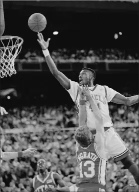  ?? GARY STEWART / AP FILE (1991) ?? UNLV’S George Ackles goes strong to the basket over Utah’s M’kay Mcgrath in a 1991 NCAA Western Regional game in Seattle. Ackles, a defensive stalwart with the Runnin’ Rebels in the early 1990s, is recovering from a staph injury that kept him from working. A Gofundme account has been set up to assist him in paying bills for his uninsured hospital stay.